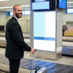 Businessman at airport going to TSA